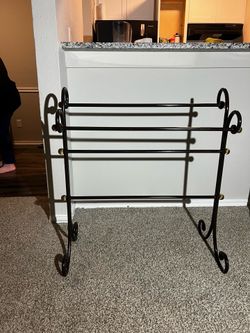 Brown metal blanket rack