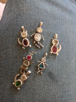 Three cats & three person charms. 5.00 Each firm