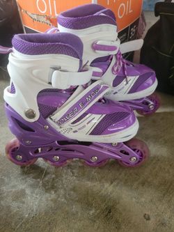 Kids roller blades fit ages 4-6 yr.