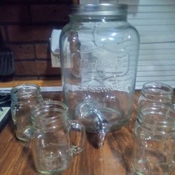 Gallon Drink Dispenser With Four Glass Mugs.