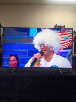 65 inch Samsung smart 4k really nice thin tv comes with remote control shows great quality clear picture works perfect guaranteed