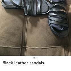 Black leather sandals.