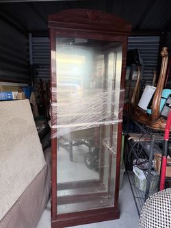 Curio cabinet with light and shelves $75