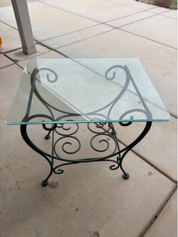Wrought iron side table with glass top