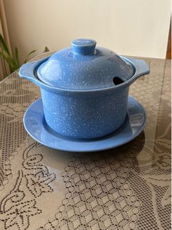 Stoneware lidded ceramic casserole dish and plate. Blue speckled design