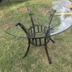 Large round glass and iron dining /dinette table