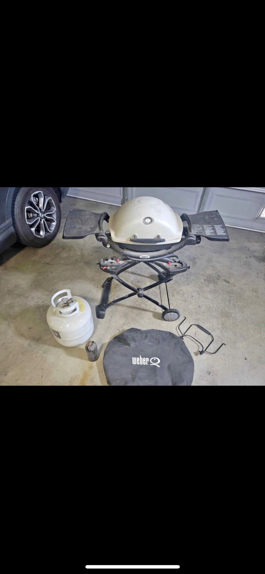 Weber Q1200 portable grill comes with stand, cover and propane tank