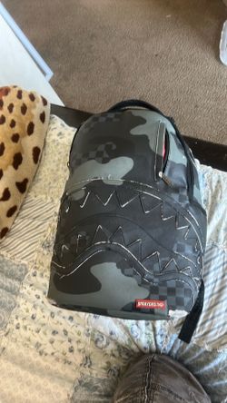 Spray.  ground  book bag