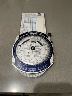 Vintage ( Aviation ) Cessna Flight Computer Slide rule from 1982 in Excellent condition with protective Red Plastic sleeve