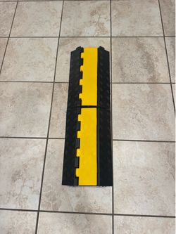 Foldable cable protector speed bump