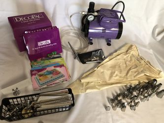 DecoPac airbrush compressor with two spray guns and 2 pastry bags with 36 frosting tips plus bakery cards with stands
