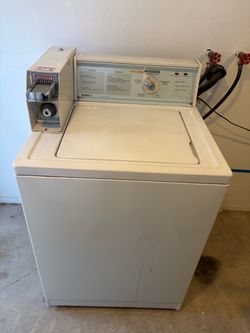 Two sets of coin operated Kenmore washer and dryers