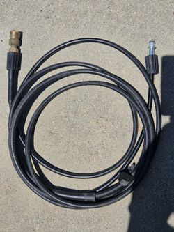 Power washer with hose and gun.