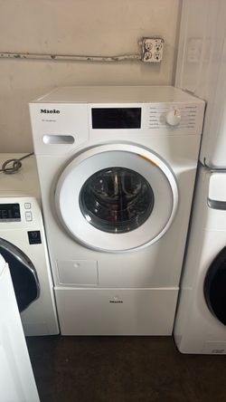 Miele compact front washer on pedestal
