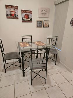 Glass top table and 4 chairs