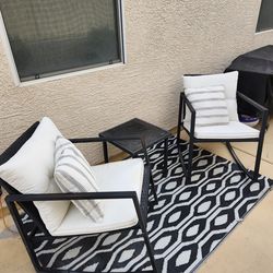 Two metal and Rattan rocking chairs