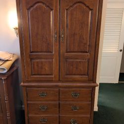 Solid Wood Armoire/Dresser.  Very Nice Condition.  Handle Needs A Screw.  