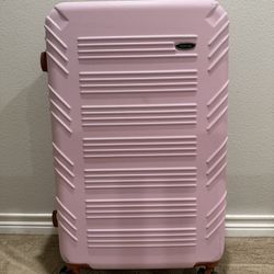 A Pink hard shell luggage 30-inch