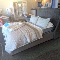 Queen upholstered bedframe only