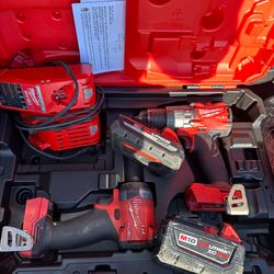 Milwaukee m18 fuel impact and hammer drill with 3.0 and 5.0 batteries charger