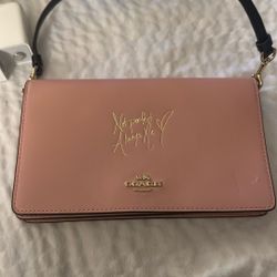 selena gomez coach pink clutch 