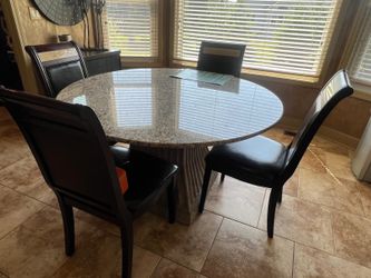 Round table with 4 leather chairs