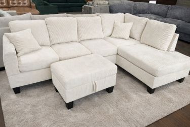 Brand new ivory color corduroy Sectional Sofa with storage ottoman and 2 accent pillows. 