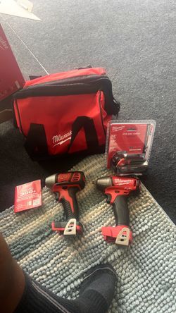 Milwaukee 3/8” impact wrench and impact driver with brand new RED LITHIUM CP2.0 battery with bag.