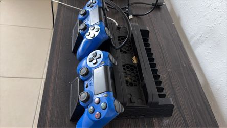 Two Blue PS4 DualShock 4 Controllers