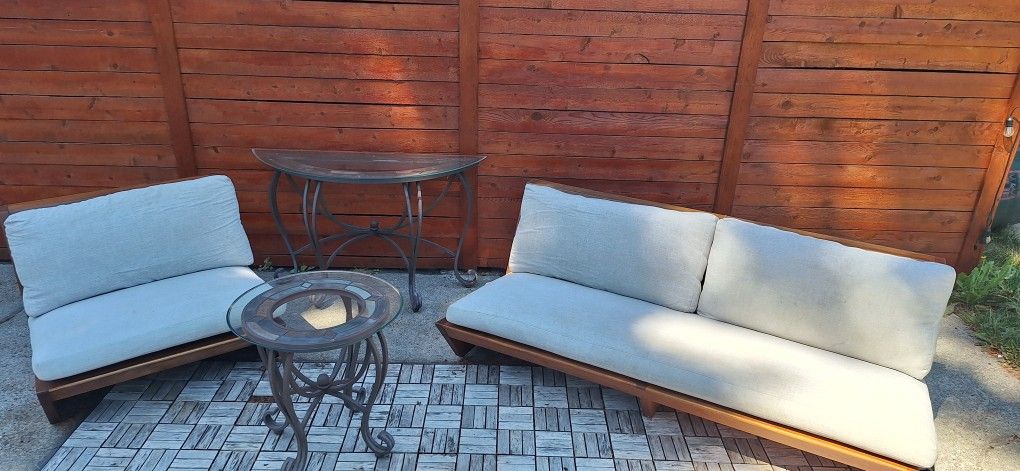 CB2 Sunset Outdoor Teak Sofa And Loveseat With Glass Tables