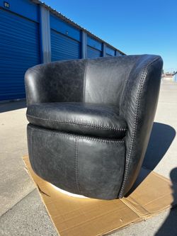 Brand New. Ashley leather Swivel Chair. Midnight Color. $299. Only 1 available