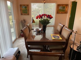 Wooden dining room table with 6 chairs