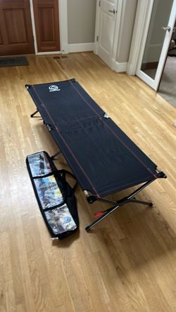 One-piece folding camping cot with tension lock $45
