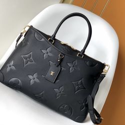 Louis Vuitton black monogram embossed leather bag