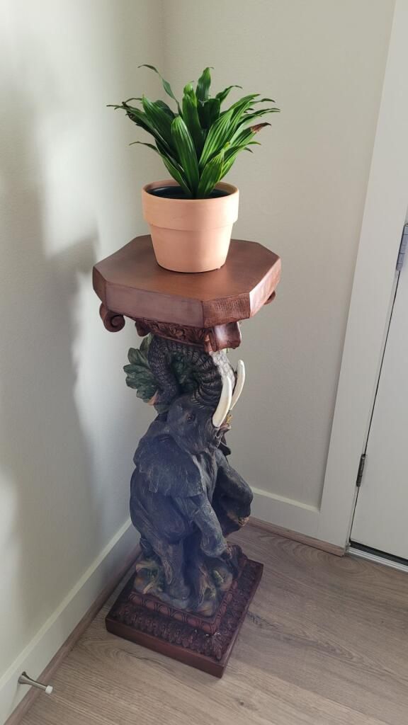 Elephant plant holder sculpture
