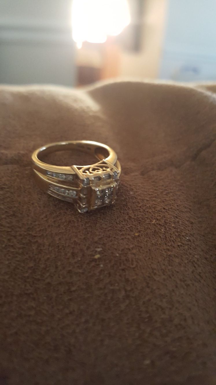14 k gold wedding ring with diamonds. This is a 6 1/2 size ring for a woman. The going price is $200.00.