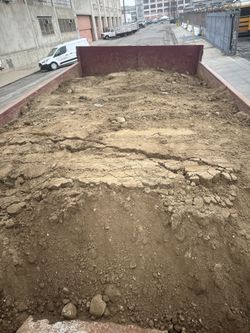 10-YARD LOWBOY DUMPSTER RENTAL FOR HEAVY CONCRETE CLEANUP