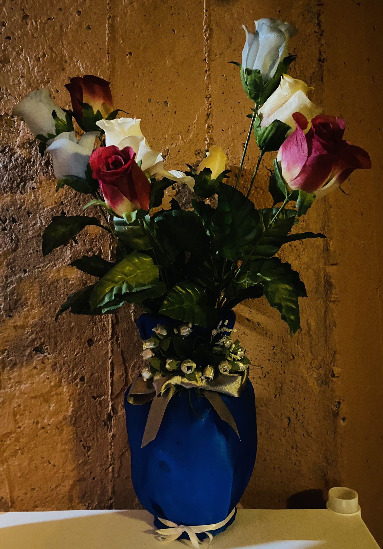 Flowers In Decorative Blue Satin Vase