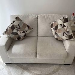 Beige 2 person Ashleys couch