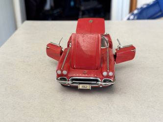 Chevrolet Corvette C1 Convertible collectible diecast model car, specifically identified as a Roman Red 1962,
