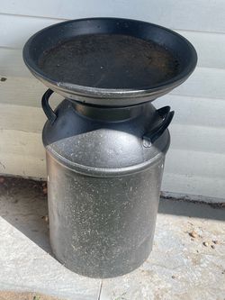 Milk can bird bath