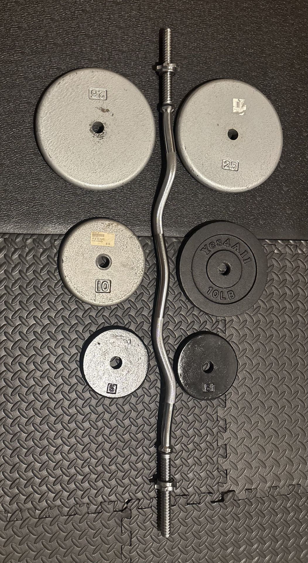 NEW Standard Steel Curl Bar with Cast Iron Weight Plates Gently Used pairs: 25#, 10 & 5 #. Total: 96 pounds