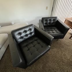 Black leather arm chairs