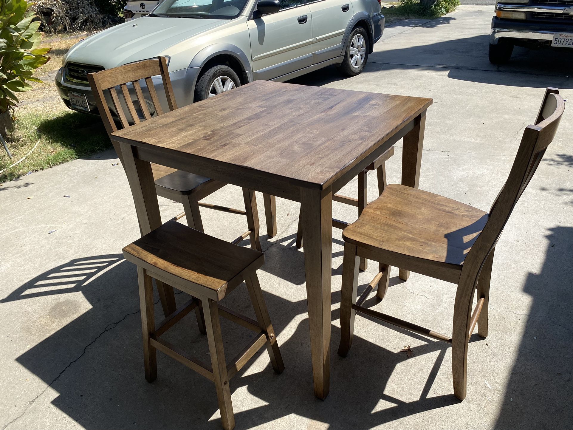 Wooden Kitchen Table With Teo Chairs And Teo Stools