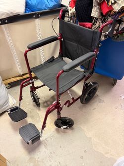 Medline Transport Wheelchair with Hand Brakes and Footrests — $90