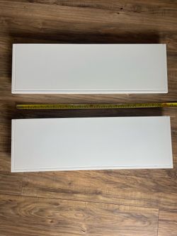 Two white floating shelves