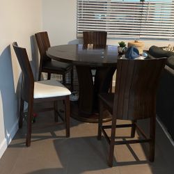 Round table, solid wood, and chairs
