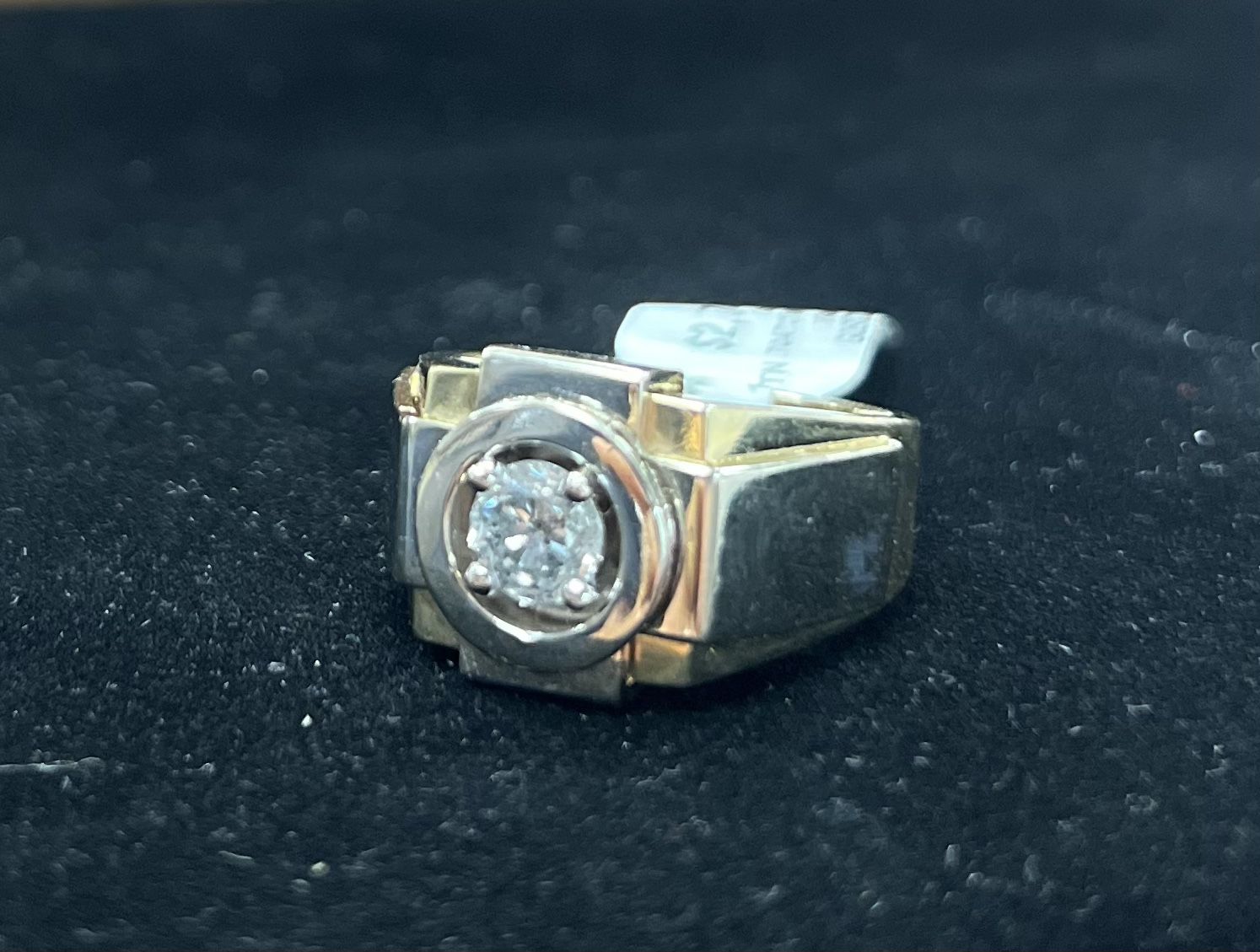 14k ring with a diamond in the center 