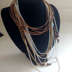 Set of 3 Brown and Cream Colored Necklaces. 54" Cream Chain Necklace w/Brown Wooden Beads, an Elegant 24" Multi-Strand Cream & Gold Chain and a Brown 