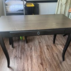 Small black desk with drawer